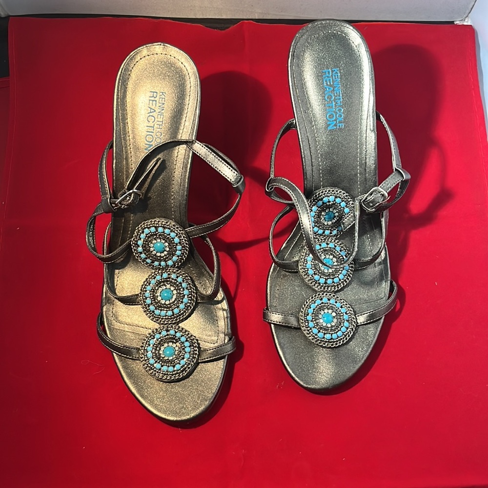 Kenneth Cole Reaction silver sandals with faux turquoise embellishments.